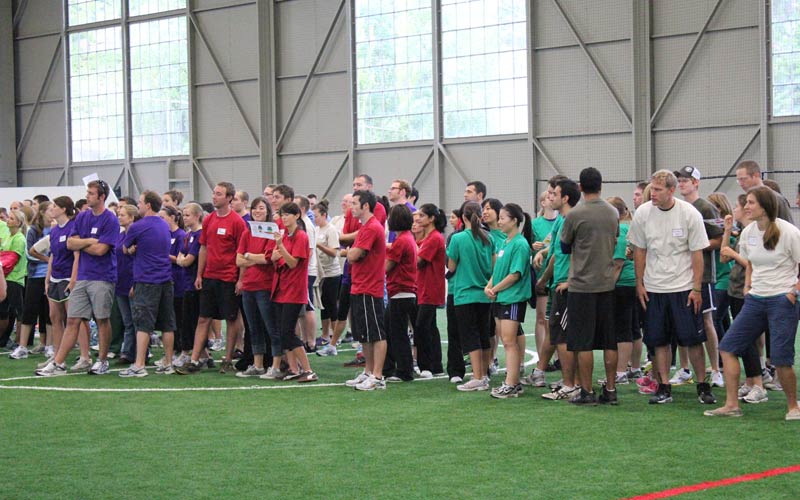 A large group of people participating in an indoor field activity during a Corporate Event at Arena Sports in Seattle