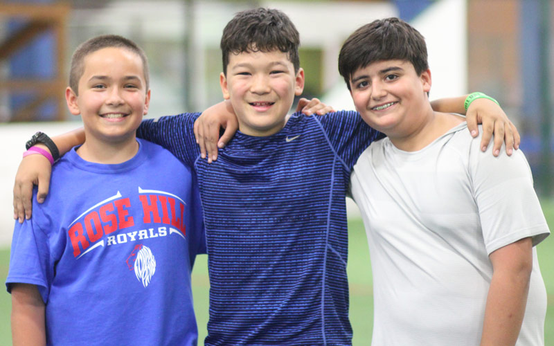 Pre-teen boys smiling for photo