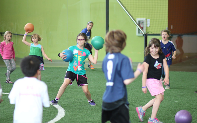 Kids playing dodgeball at School's Out Camps