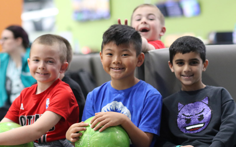 Boys smiling at Birthday Parties bowling