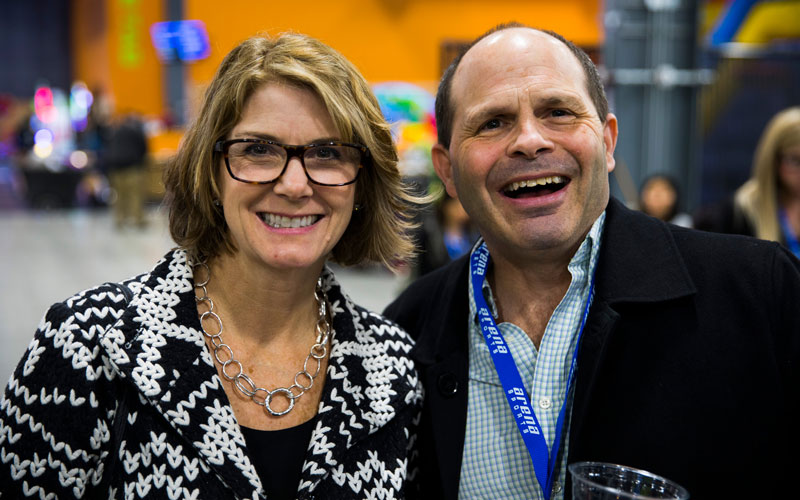 A man and woman smiling during a Corporate Event at Arena Sports in Redmond