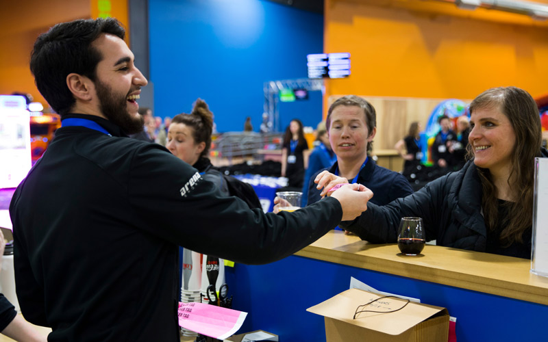 Employment host smiling with customers