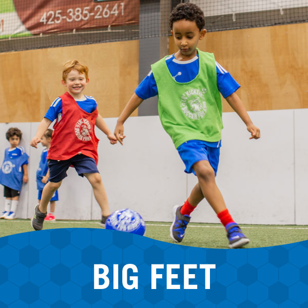 Kids work on soccer drills in Lil' Kickers Big Feet class