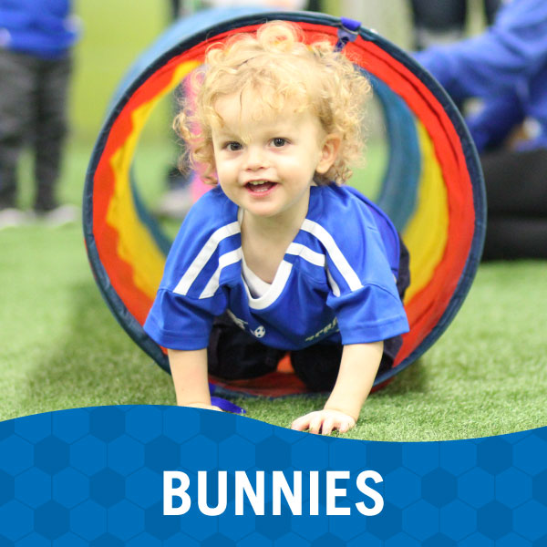 Small child playing in a Lil' Kickers Bunnies class