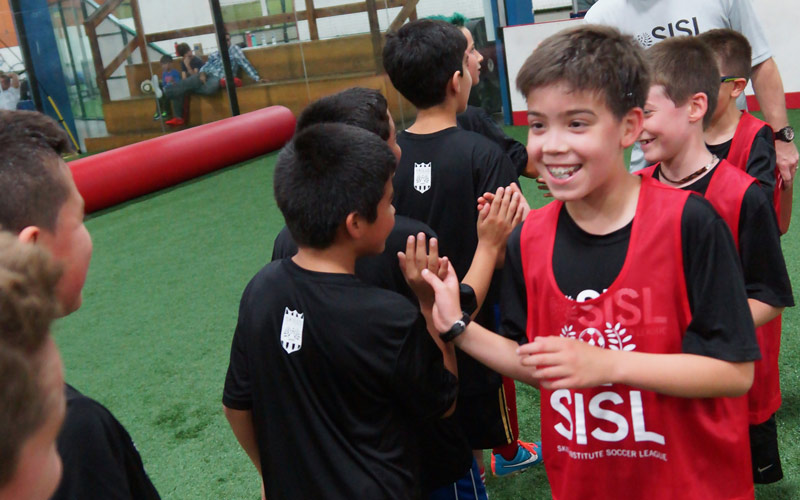 Skills Institute Soccer League sportsmanship high-fives