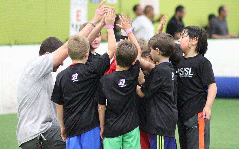 Team huddle in Skills Institute Soccer League