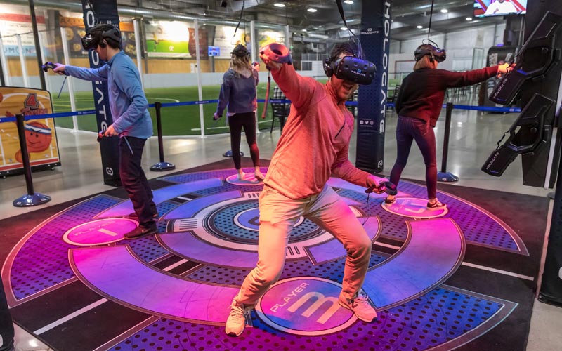 Group playing virtual reality game at Arena Sports Mill Creek