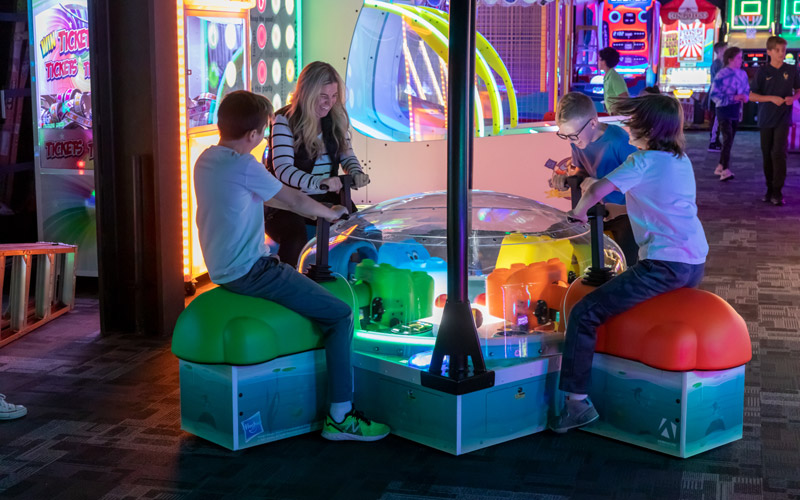 Family Playing Hungry Hippos Arcade Game