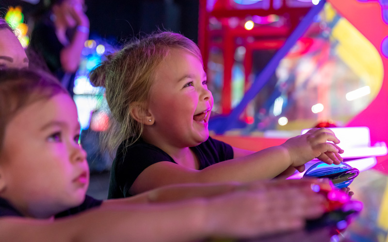 Kids playing arcade games