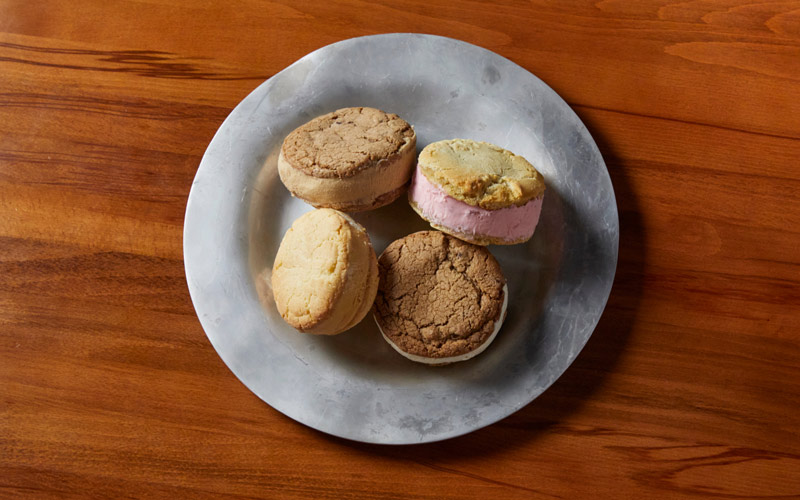 Four ice cream sandwiches served on a silver plate