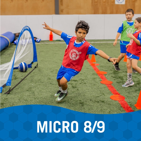 Boy celebrates after making a goal in Lil' Kickers Micro 8/9 class