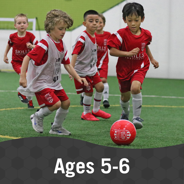 Skills-Institute-Ages-5-6 Children play soccer in Skills Institute 5/6 class