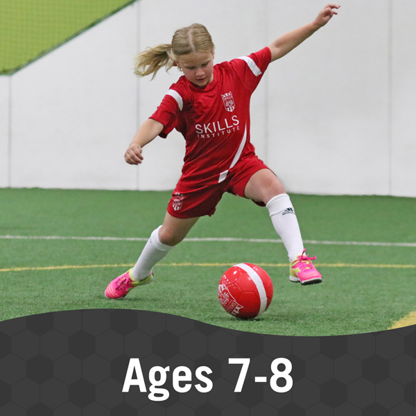 Skills-Institute-Ages-7-8 Girl kicks a soccer ball during Skills Institute 7/8 class
