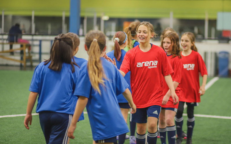 Youth Soccer Girls Teams High-Fiving