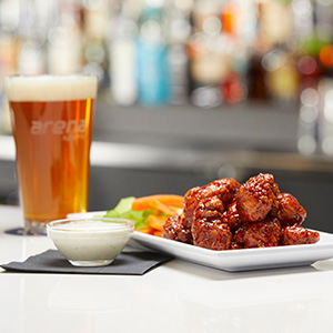 BBQ wings and a cold drink from the restaurant and bar at Arena Sports