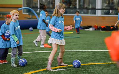 Kids play field games during Summer Camp at Arena Sports