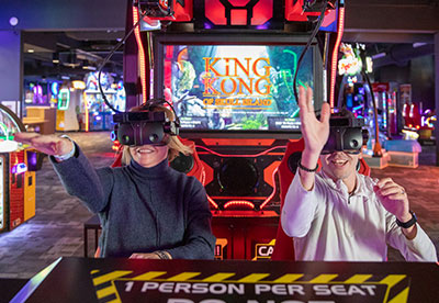 A man and woman play a virtual reality game in the Arcade during a group event at Arena Sports Issaquah