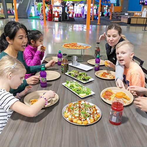 Families enjoy dining at Arena Sports Mill Creek after a fun laser tag session