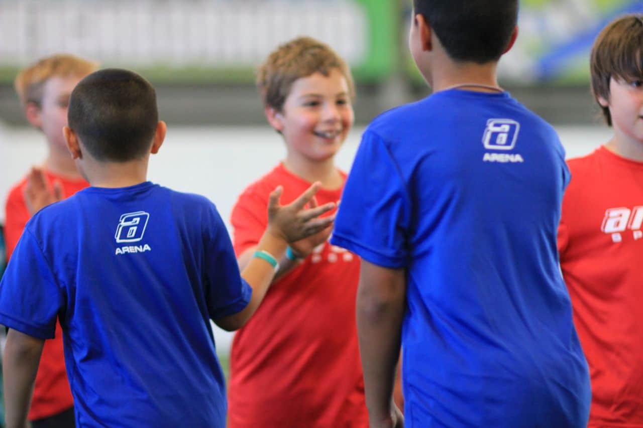 young boys celebrating after youth soccer league game