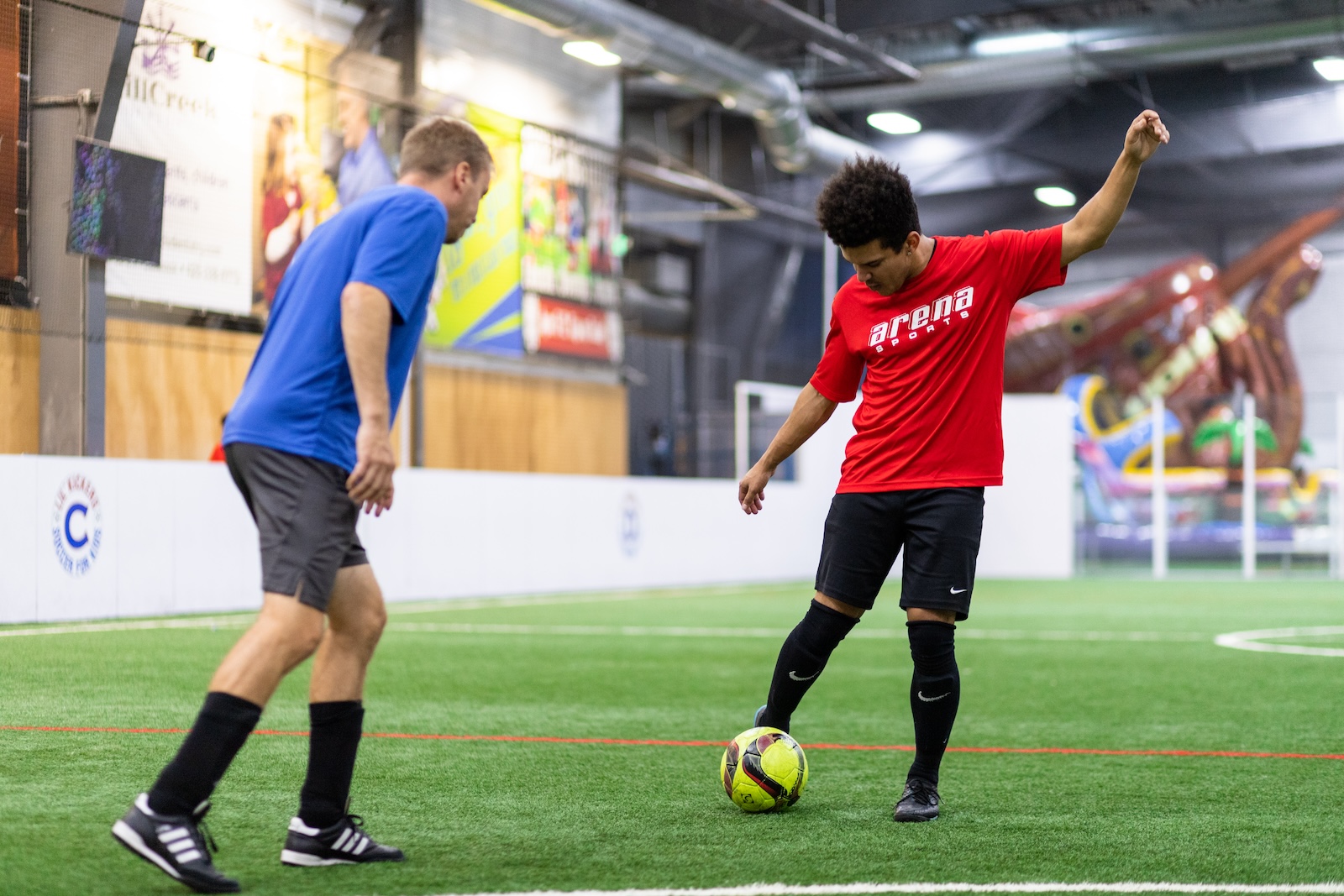 two men playing soccer