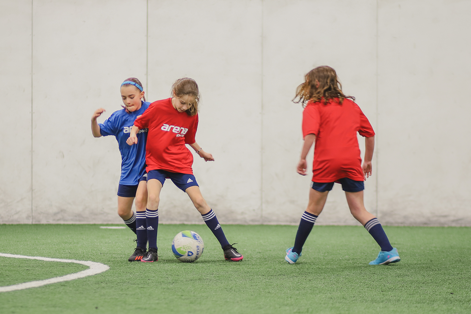 Girls playing in youth leagues at Arena Sports.